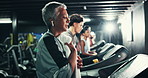 Woman, towel and earphones on treadmill in gym for fitness, endurance and intense workout with sweating. Tired, music and mature female person with machine for exercise, running and cardio training