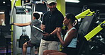 Gym, woman and personal trainer with tablet, advice and explanation for training service and smile. Health club, people and review of consent form with instructor, fitness and happy for schedule