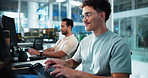 Computer, face and typing with man programming at desk in office as graphic designer for software development. Business, coding and keyboard with happy developer or programmer at work for web design