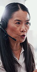 Angry woman, call center and conversation in office for customer complaint, order mistake and fail. Asian sales agent, mature and frustrated for telemarketing, talking and help with business problem