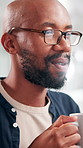 Coffee, talking and business man in video call with journalist in virtual webinar. Black person, conference and drink in online meeting with news reporter with computer reflection in creative office