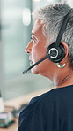 Office, mature woman and customer service on headset for call center, talking and crm help with listening. Computer, business person and female agent with advice for sales support, consulting and faq