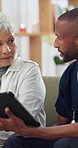 Tablet, consultation and nurse with senior woman in home with telehealth, advice or healthcare support. Digital technology, discussion and male caregiver with elderly patient for medical service.