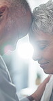 Forehead, love and smile with mature couple in home together for bonding, safety or trust. Marriage, relax and security with happy senior people in apartment for retirement, romance or wellness