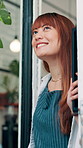 Coffee shop, thinking and woman at front door in cafe for friendly service, small business and hospitality. Restaurant, cafe and barista, waiter and server with confidence, smile and happy for career