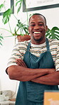 Black man, face and smile in coffee shop with barista, employee or waiter in apron for hospitality industry. Happiness, arms crossed and African person with professional pride for service at diner