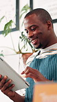 Coffee shop, happy and black man on tablet for online checklist, store inventory and menu website. Restaurant, hospitality and waiter on digital tech for service, planning and orders in cafeteria
