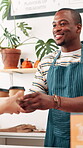 Black man, waiter and serving coffee at cafe for giving order, customer service and collect takeaway. Smile, male person and beverage and drink purchase, hospitality industry and consumer checkout 