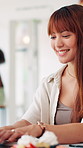 Break, laptop and smile with woman in coffee shop for education, hospitality or service. Computer, research and typing with happy student in cafe or restaurant for college or university scholarship