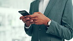 Business, man and hands with phone in office for typing text message, email response or client networking. Financial advisor, employee or smartphone for investment feedback, communication or research