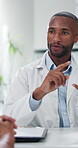 Healthcare, doctor and man with patient, talking and explaining diagnosis in clinic, helping and checkup. Hospital, people, medical professional with advice for treatment, appointment or consultation