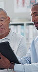 Clinic, men and doctor with patient, tablet and explaining results of test, healthcare and talking. Hospital, medical professional and senior person with tech for digital records, online or diagnosis