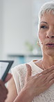 Senior woman, patient and talking with doctor for gastro reflux, throat inflammation or tonsillitis at clinic. Elderly, female person or client with healthcare worker for consultation or checkup