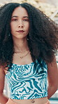 Face, woman and confident for fashion in city with streetwear, edgy clothes and trendy style for travel. Portrait, female person and pride with cool swag, urban outfit and unique cosmetics and beauty