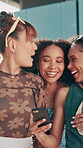 Girl, friends and laughing with phone in city for social media joke, online gossip and reading funny post. Gen z people, walking together or watch video for bonding, internet browsing or conversation