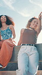 Outdoor, friends and women with smile, hangout and bonding on reunion in city, pointing and fun on roof. Urban, college students and happy people on weekend, relax and gen z girls on break or summer