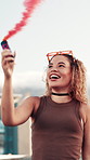 Woman, dancing and flare with smile in city with spinning, play or celebration with fashion in summer. Gen z person, girl and happy for smoke, cheers or color with edgy streetwear on road in Colombia