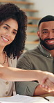 Happy couple, documents and handshake with financial advisor for meeting, agreement or finance proposal. Man, woman or consultant shaking hands with paperwork for budget, deal or mortgage settlement