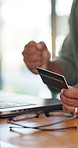 Person, hands and winning with credit card on laptop for online transaction, payment or banking. Closeup, shopper or user with fist pump on computer for ecommerce, good deal or sale promotion at home