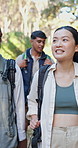 Walking, friends and group on adventure in nature, backpacking and exploration of woods or trekking. Outdoor, together and people on journey in forest, travel and hiker with sportswear for vacation