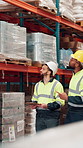Businessmen, walking or checking stock at warehouse for distribution service or storage control. Male people, contractor or employees with inventory for inspection, supply chain or logistics at depot