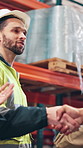 Businessman, logistics and handshake with applause for agreement, partnership or b2b at warehouse. Male person, employee or contractor shaking hands with deal for supply chain or teamwork at storage