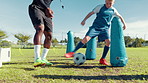 Dribble, practice or soccer with coach and kid on field for ball control, exercise or training. Children, drill and fitness with football player on sports pitch for agility, skill or technique