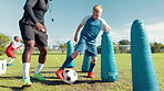 Drill, practice or soccer with coach and kid on field for ball control, exercise or training. Children, dribble and fitness with football player on sports pitch for agility, skill or technique