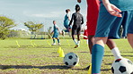 Kids, soccer players and training with coaches, fitness and skills development with technique. Closeup, children and sports with football, practice or exercise with cardio, motor coordination or game
