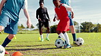 Active, kids and dribble with ball for soccer practice, training and fitness exercise. Children, equipment and drill with cones for sports workout, skills technique and learning agility of team match