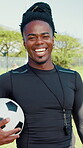 Field, man and face of coach with football, training experience and happiness with sports. Outdoor, male person and trainer in portrait for confidence, player development or soccer club with laughing