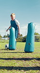 Soccer field, kid and training with ball for sports, match competition and child for drill progress. Outdoor, football and boy player with inflatable for practice, kick learning and fitness for game