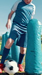 Field, child and training with football for sports, match competition and coach for guidance. Outdoor, instructor and boy player with inflatable for soccer practice, kick learning or fitness for game