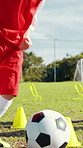 Child, dribble and ball for soccer practice for training, kick and fitness exercise. Active kid, equipment and cones for drill of sports workout, skills technique and learning agility for match game
