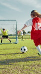 Kick, kids or girl soccer player with goal for winning at game or match in youth tournament. Sports, exercise or back of football athlete shooting ball in net at target practice on field at stadium