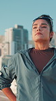 Fitness, runner and tired woman breathing in city for sports break, exercise and thinking of wellness. Resting, fatigue and athlete outdoor for cardio recovery, exhausted and relax for body health