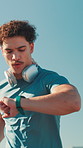 Man, athlete and watch for fitness, wellness challenge and training for marathon in city. Performance, runner and time with endurance for exercise, cardio and jog in morning on road with workout