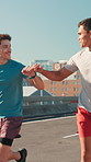 City, men and fist bump for workout, wellness challenge and training for marathon on bridge. Outdoor, friends and running with endurance for exercise, cardio and morning jog on road with fitness