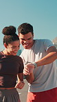 High five, running and couple in city for exercise, marathon training and tracking cardio workout. Sports, smart watch and man with woman celebrate for fitness goals, endurance and challenge in town