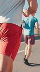 Back, people and running in city with cardio in street, marathon or race with exercise challenge outdoor. Fitness, runner group and performance with workout, sports and athlete men in urban town