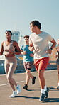City, group and friends for exercise, wellness challenge and training for marathon on bridge. Women, man and running people with endurance for fitness, cardio and morning jog on road with workout