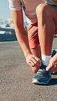 Hands, athlete and tie shoes in road to start running, exercise preparation and marathon training in city. Fitness, person and getting ready with sneakers on bridge for sports workout and performance