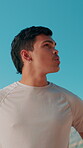 Thinking, athlete and man on break, blue sky and planning for workout in environment, serious and healthy. Outdoor, contemplating and person with ideas for routine, morning or thoughtful for exercise
