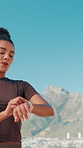 Runner, smart watch and breathing with woman in city for lap time, tracking performance and fitness stats. Health, relax and workout target with person outdoor for athlete challenge and training