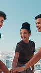Outdoor, friends and hands with huddle for fitness, celebration and motivation for running together. Blue sky, solidarity and people with stack for support, synergy or excited group for exercise goal