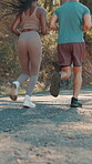Running, team and back of couple in nature for training, marathon practice and support. Sports athlete, fitness partner and wellness with man and woman on forest path for runner workout and exercise
