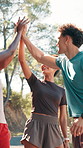 Outdoor, friends and smile with high five for fitness, celebration and motivation for running together. Nature, applause and people with hands for support, synergy and excited group for exercise goal