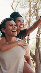Outdoor, couple and piggyback with walking for fitness, sightseeing and bonding with conversation. Nature, carrying and man with woman for relationship, exercise break and laughing with pointing 