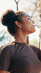 Nature, woman and fitness with water to drink, nutrition or break for running challenge. Low angle, female person and runner with thirst for h2o liquid, hydration or wellness after workout outdoor