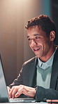 Business, night and man in office, laptop and typing with deadline, internet and research for article. Person, evening and journalist in workplace, pc and writing with news report, review or feedback
